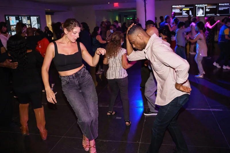 A photograph of two people dancing