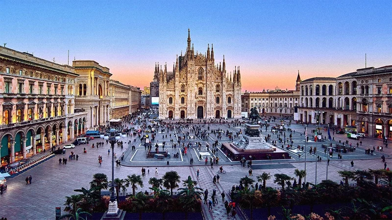 Image description: Aerial view of tourists walking in plaza in front of Milan cathedral