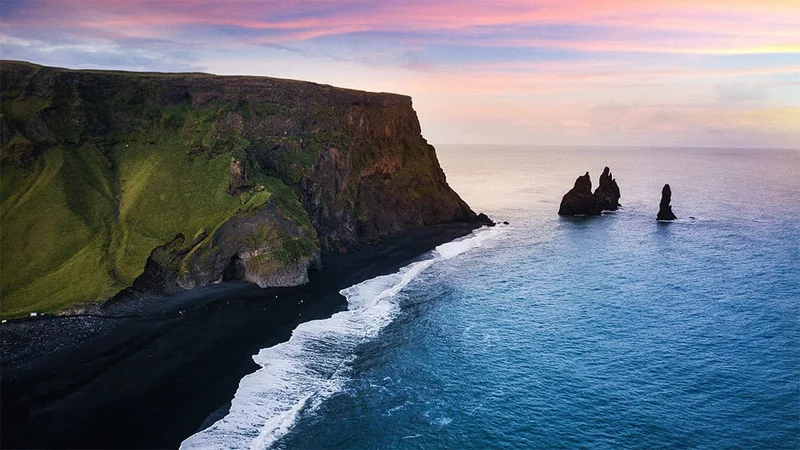 Image description: Icelandic coastal landscape at sunset