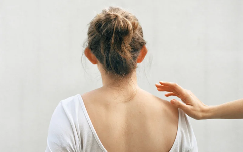 Photographer Emily June Smith created this self-portrait to reflect her experience living with ADHD and autism, which she concealed for years after feeling misunderstood in school.