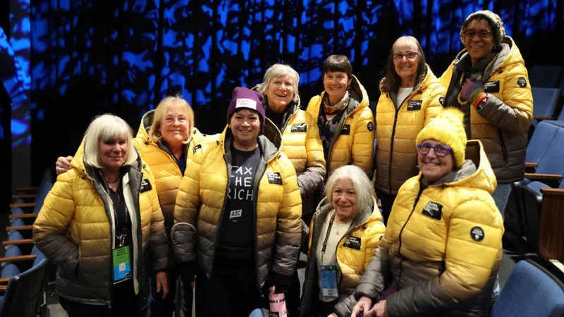 Image of 2026 Sundance Film Festival volunteers in signature yellow and gray Kenneth Cole
jacket.