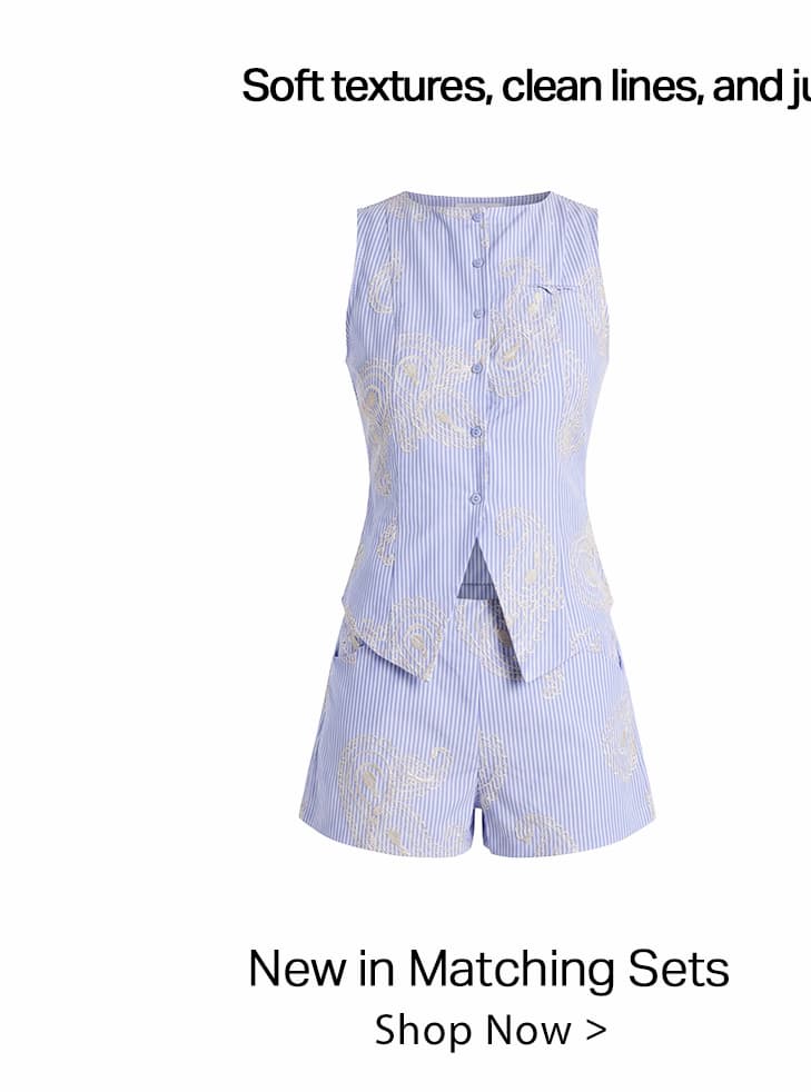 Light blue pinstripe matching set with cream paisley embroidery, featuring a sleeveless button-front top and shorts. New womenswear collection.