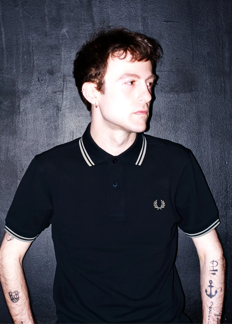 Male wearing a M3600 Twin Tipped Fred Perry Shirt