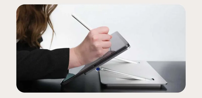 Lab22 desk tech, an image of a woman writing on an ipad.