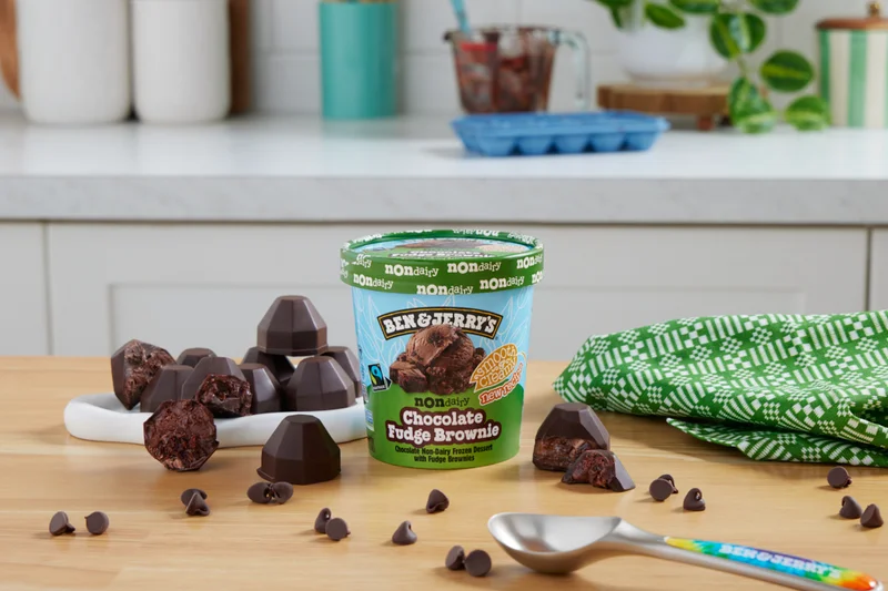 Pint of Ben & Jerry's Chocolate Fudge Brownie Non-Dairy next to some chocolate truffles.