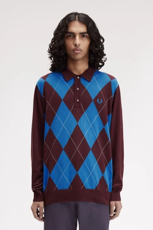Male model wearing a Fred Perry Argyle Knitted Shirt in Oxblood