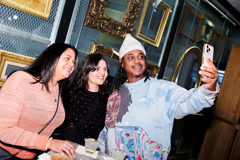 Three people taking a selfie and smiling
