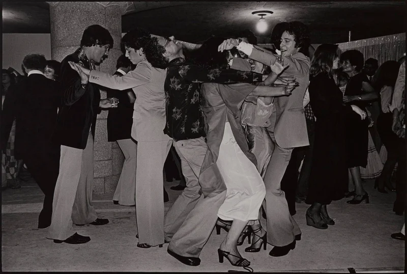 A black-and-white photograph of people dancing