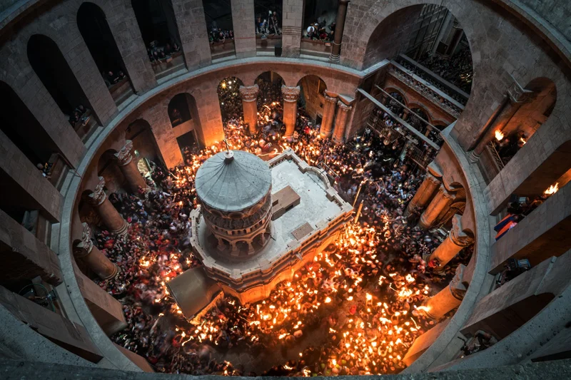Worshippers in Jerusalem’s Church of the Holy Sepulchre surround the restored Edicule, a shrine that Christian tradition says was built over the burial place of Jesus Christ. The shrine attracted global attention in 2016 when restorers uncovered remnants of an ancient tomb behind its ornate walls.