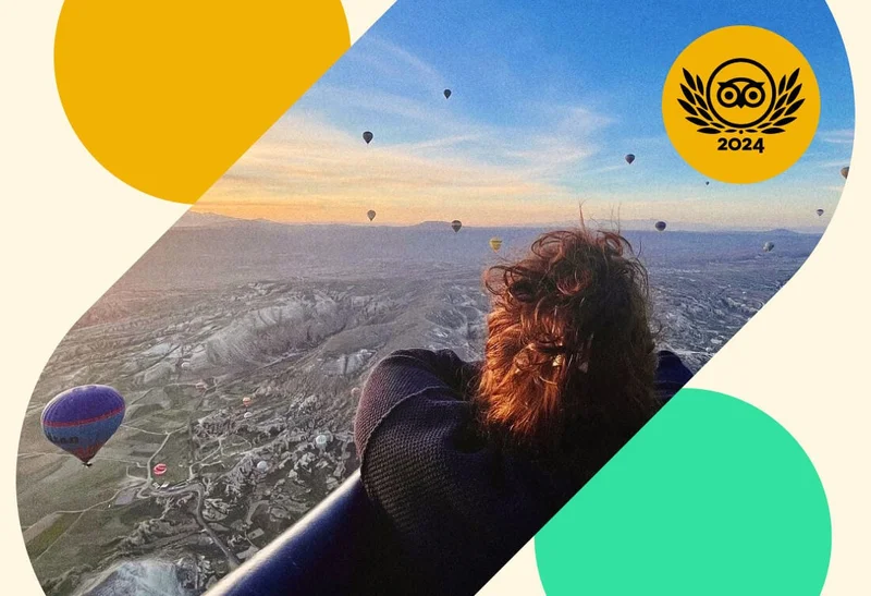 Image Description: Traveler in a hot air balloon gazing into a sky filled with other hot air balloons in Cappadocia, Turkey
