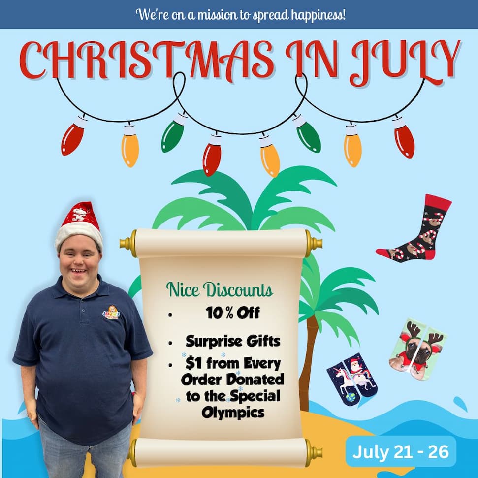 John holding up a pair of socks inviting people to our Christmas in July sale
