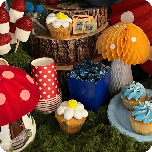 mushroom decorations, moss, a mushroom house craft, blue popcorn and cupcakes for a Smurfs party for kids mushroom decorations, moss, a mushroom house craft, blue popcorn and cupcakes for a Smurfs party for kids