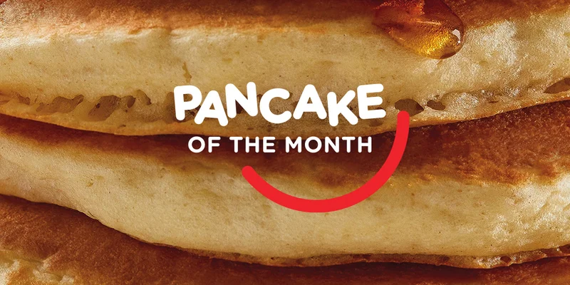 Pancake of the Month logo on a stack of pancakes