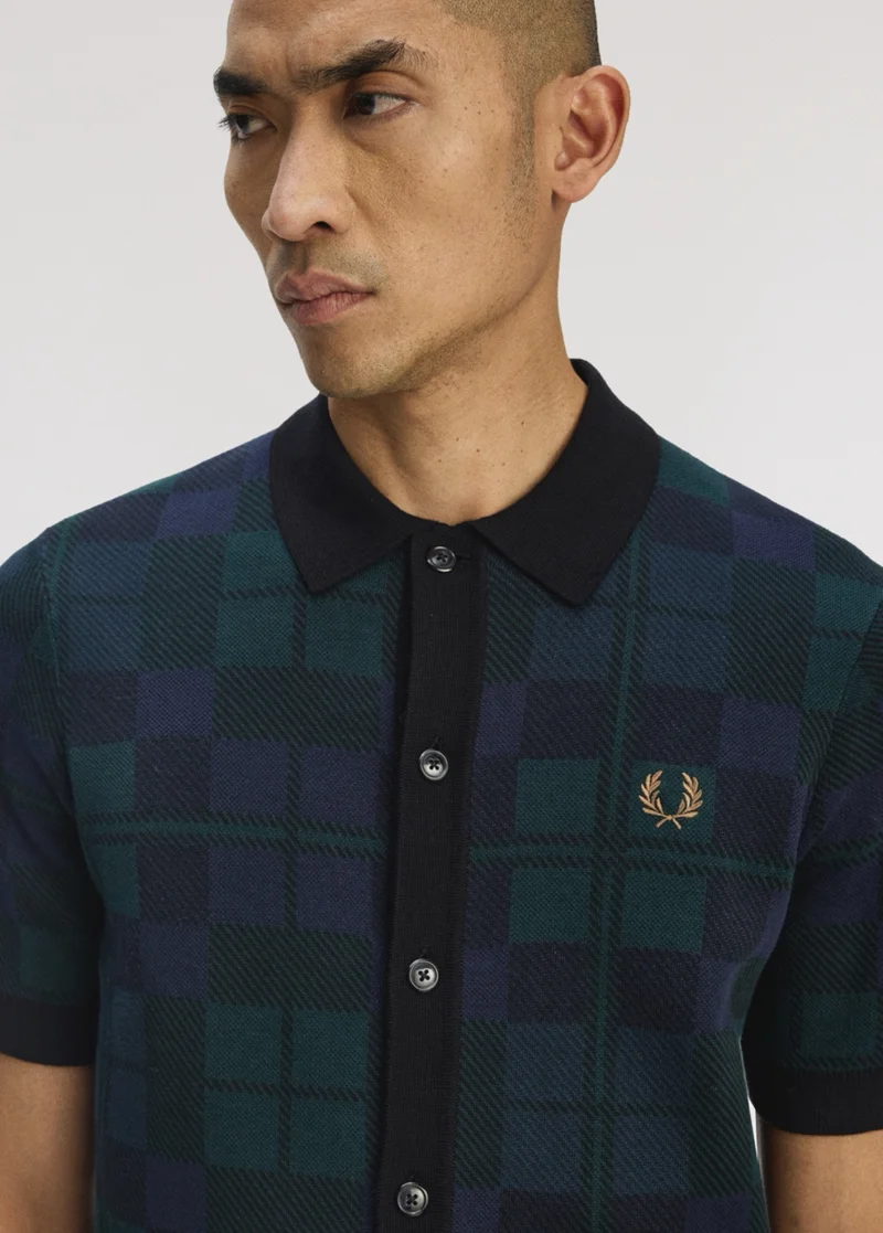Male model wearing a Fred Perry Black Watch Tartan Knit Shirt