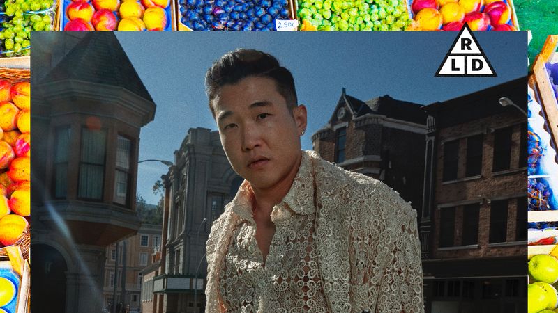 Image may contain: Joel Kim Booster, Photography, Face, Head, Person, Portrait, City, Road, Street, Urban, and Adult