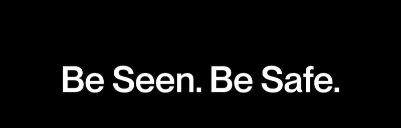 Black banner with the message “Be Seen. Be Safe.”
