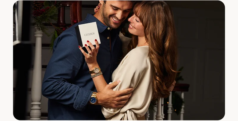 A couple embrace after receiving the perfect Citizen Holiday Gift