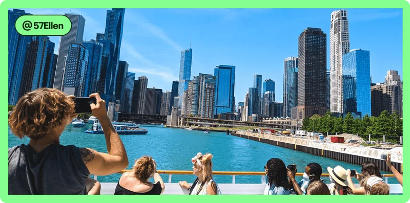 Image description: Travelers taking photos and enjoying the view on a Chicago River Architecture Cruise, photo taken by @57Ellen