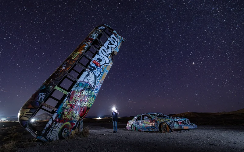 The International Car Forest of the Last Church in Goldfield, Nevada is not your typical forest—instead of leafy trees reaching skyward, dozens of colorfully painted, graffiti-covered automobiles stand dramatically in the desert soil.