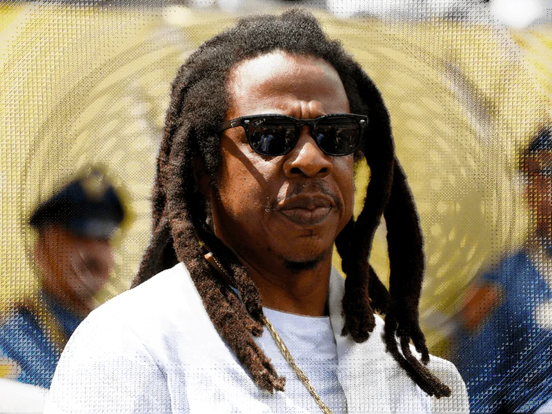 Image may contain: Jay-Z, Accessories, Sunglasses, Adult, Person, Head, Face, Photography, Portrait, Happy, and Smile