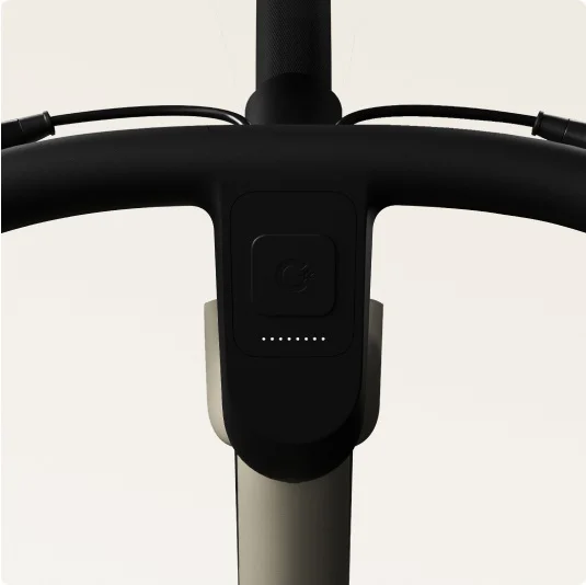Close-up of a Cowboy bike’s battery level LED indicator integrated into the handlebars.