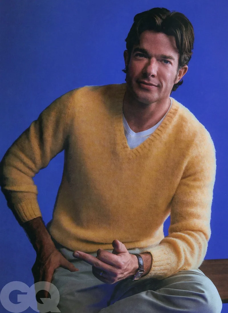 Image may contain: John Mulaney, Photography, Face, Head, Person, Portrait, Wristwatch, Adult, Clothing, and Knitwear