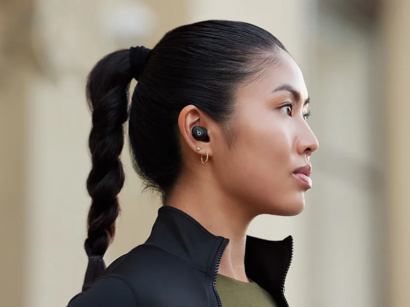 Person wearing Beats Solo Buds in Matte Black