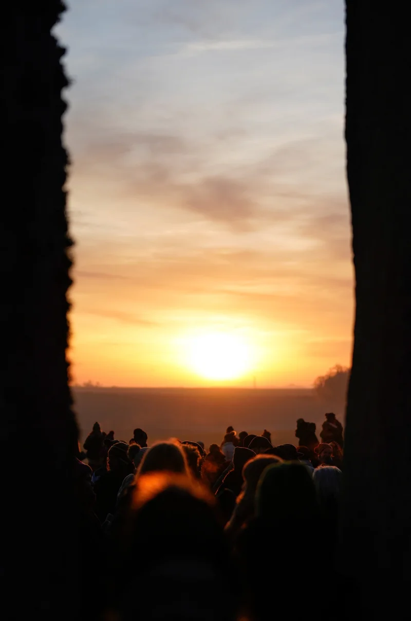 People gather at Stonehenge to celebrate the winter solstice, an ancient ritual marking the shortest day of the year and the gradual return of sunlight. Experts highlight how drawing on ancient wisdom and shifting our mindset could help us thrive during the colder months.