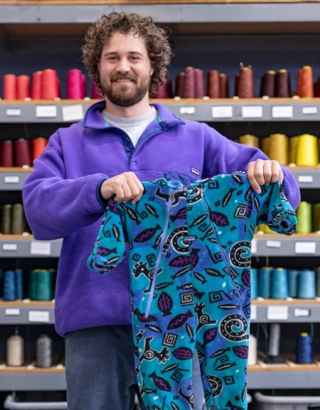 Photos of a person holding up a newly repaired garment and