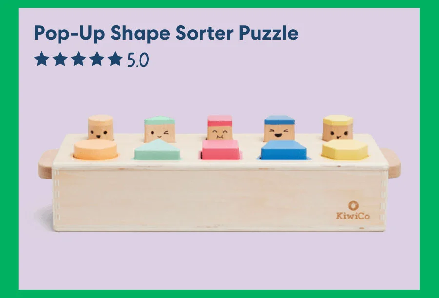 A wooden puzzle toy featuring colorful geometric shapes that pop up when sorted correctly, labeled ''Pop-Up Shape Sorter Puzzle – ★★★★★ 5.0''.
