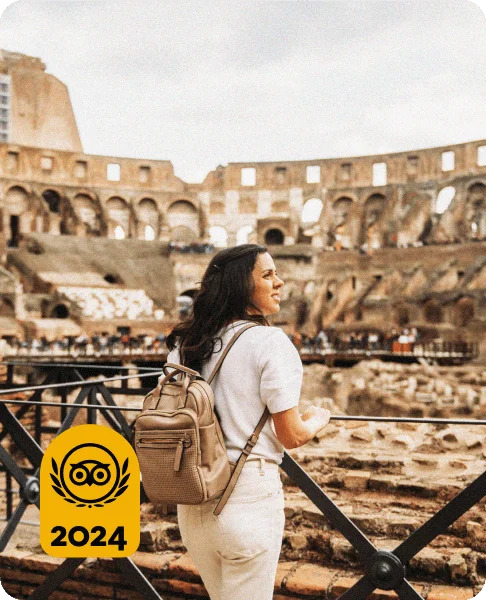 Image Description: A female traveler admiring the interiors of the Colosseum in Rome, Italy