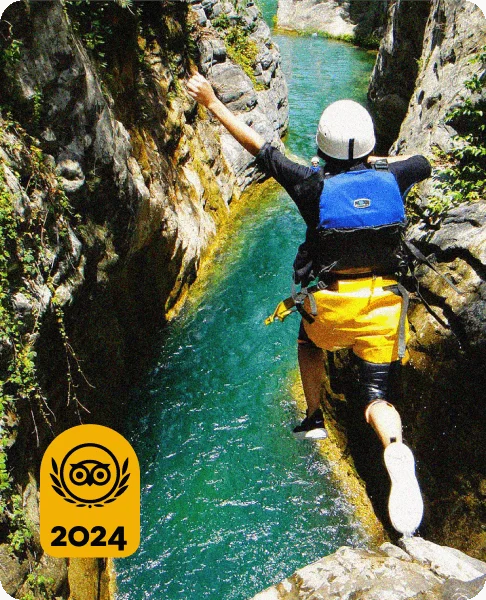 Image Description: A traveler cliff diving into a gorge during a canyoning activity in Mexico