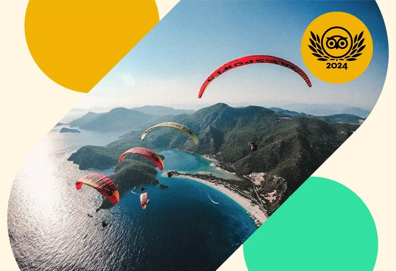 Image Description: Aerial view of parachuters sailing toward an island on a sunny day, overlaid with a gold 2024 Travelers’ Choice Awards Best of the Best badge