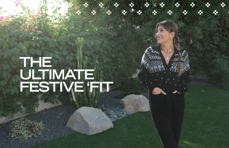 brunette woman wearing black fair isle knit jumpsuit with caption 'the ultimate festive 'fit'