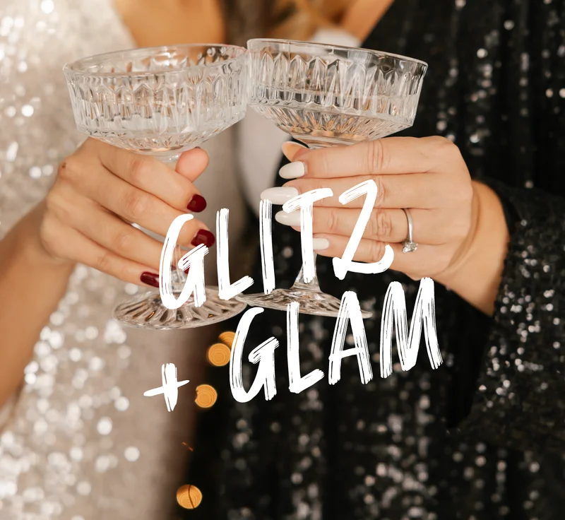 close up of hands holding cocktail glasses with sequin blackground. Text reads glitz & glam