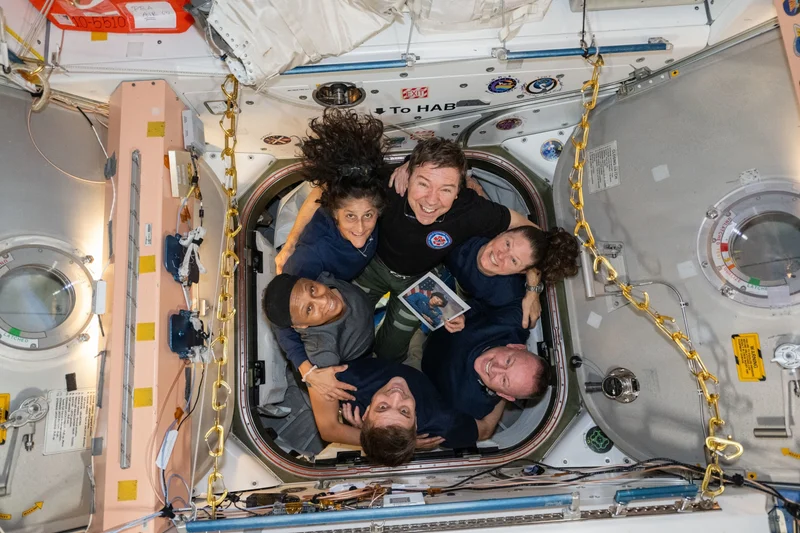 NASA astronauts (clockwise from bottom) Matthew Dominick, Jeanette Epps, Sunita Williams, Mike Barratt, Tracy Dyson, and Barry Wilmore, pose for a team portrait on the International Space Station.