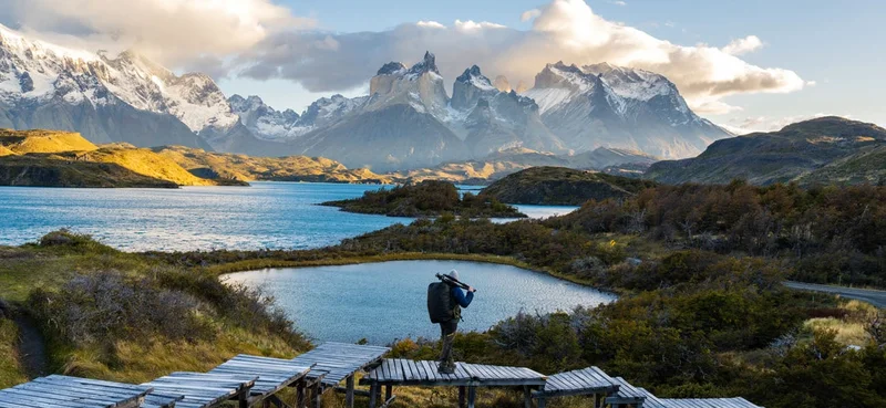 Photographer admiring the view at Torres del Paine National Park, Chile.