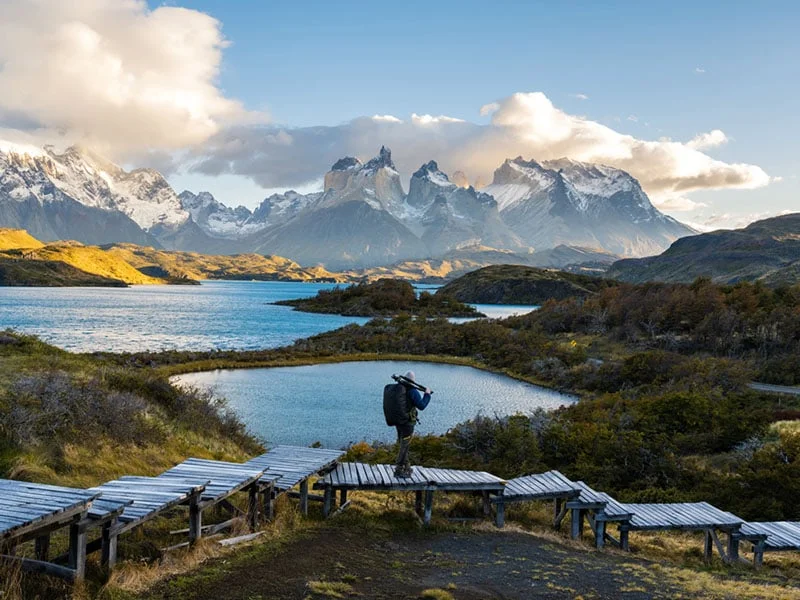 Photographer admiring the view at Torres del Paine National Park, Chile.