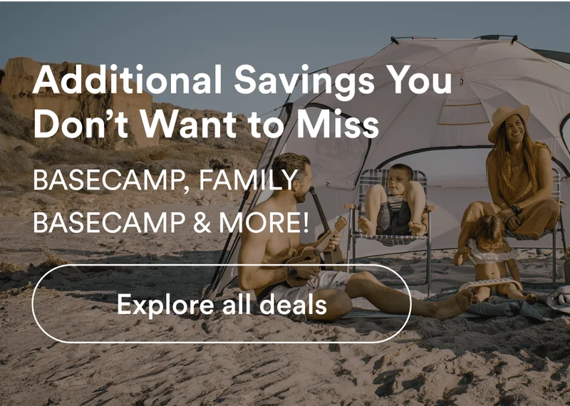 A family utilizing the Family Basecamp on the beach