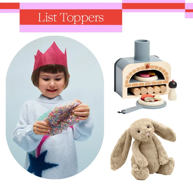 A little girl wearing a paper crown; a toy pizza oven and plush rabbit.
