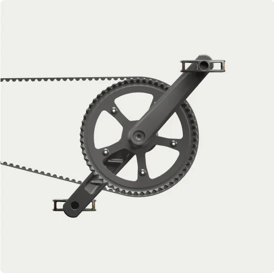 Close-up of the belt drive system on a Cowboy bike, showcasing the sleek chainring and pedal design.