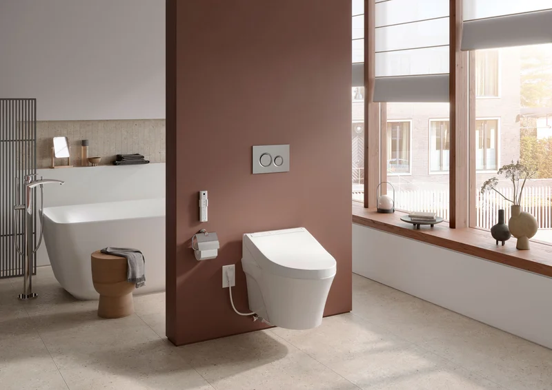 A TOTO WASHLET is displayed in a modern open concept bathroom.