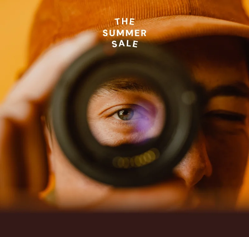 Man looking into lens - The Summer Sale