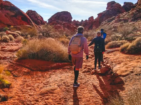 Image Description: Two people hiking in the desert.
