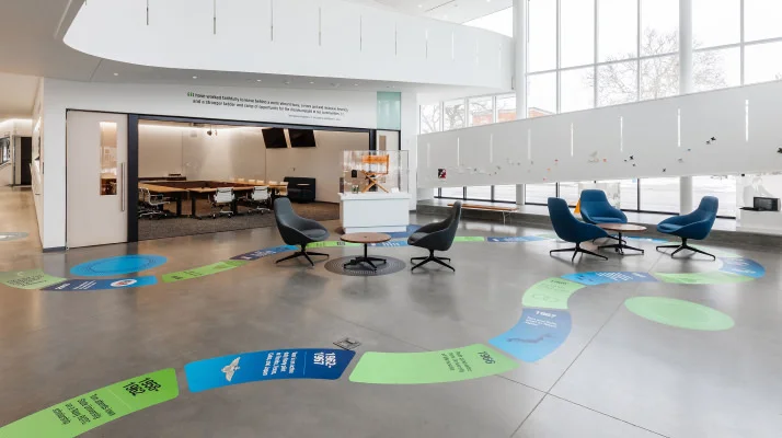Tom and Ruth Harkin Center first floor gallery and event space furnished by MillerKnoll, including Herman Miller Eames Tables and NaughtOne Always Lounge Chairs.