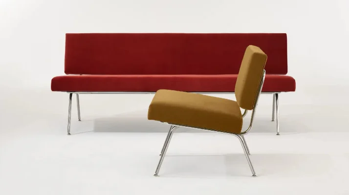 Florence Knoll Model 33 Sofa in red with Model 31 Lounge Chair in yellow in the forefront.