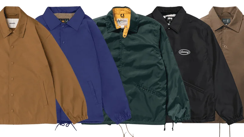 5 different coaches jackets arranged in a row.