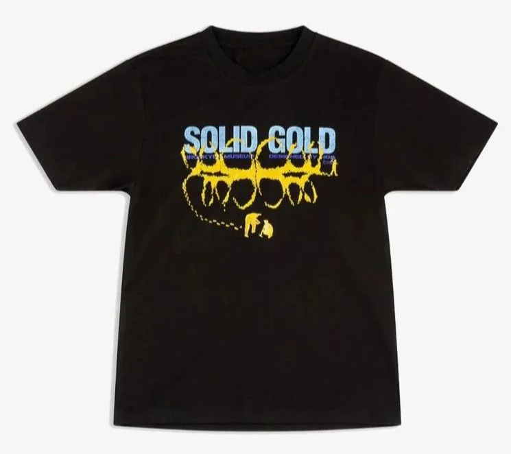 Black T-shirt with “Solid Gold” written on it