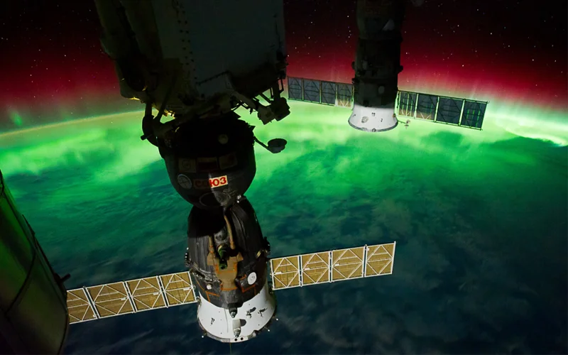 The aurora australis glows above the Tasman Sea near New Zealand, photographed from the International Space Station in 2011.