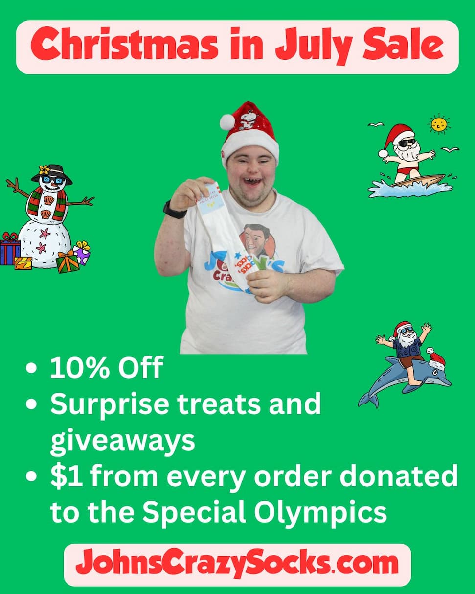 John holding up a pair of socks inviting people to our Christmas in July sale